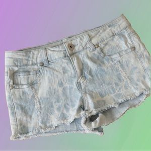 Distressed tie dye light denim shorts